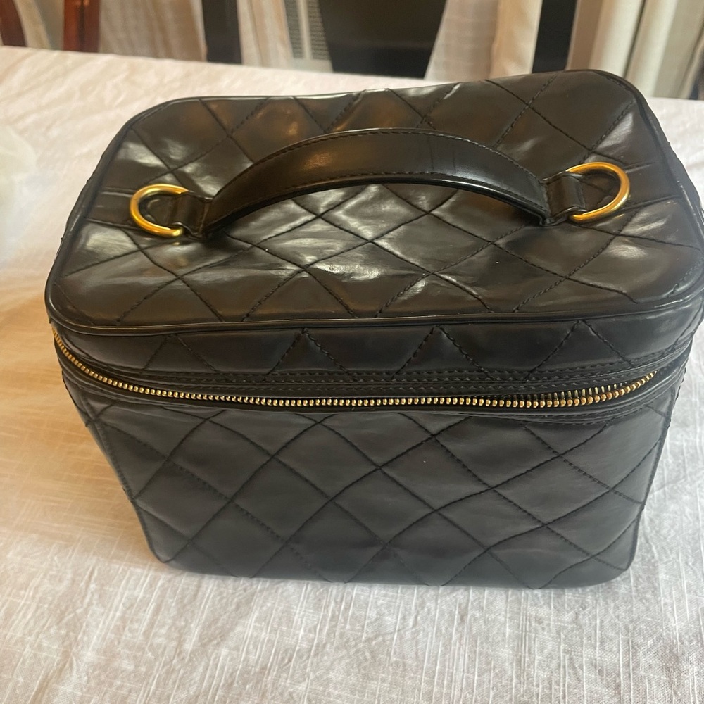 CHANEL Black Leather Interior with Gold Accents
